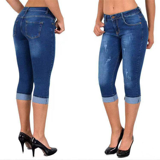 Slitna capris-jeans med upprullad fåll